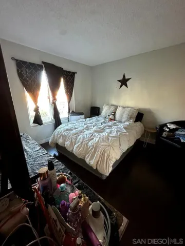 a bed room with a bed and a television