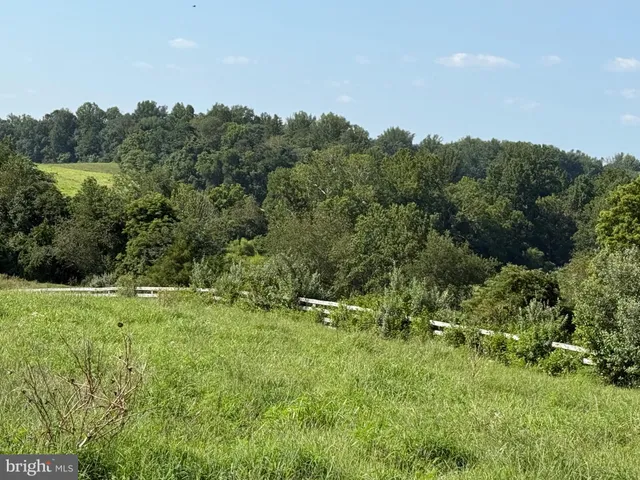an aerial view of a house with a ocean view