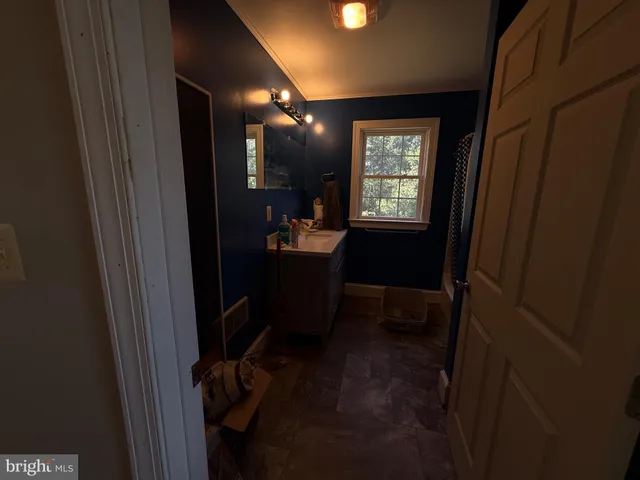 a living room with furniture rug and wooden floor