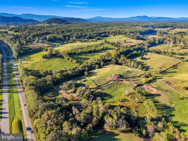a view of a city with mountains in the background