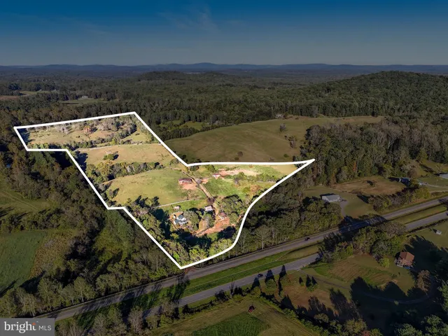an aerial view of a couch and chairs