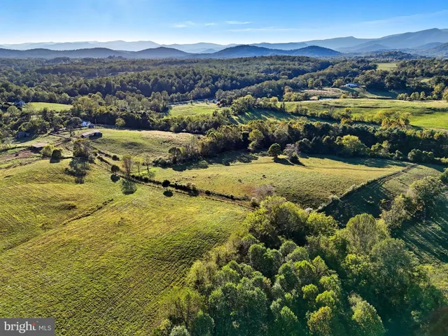 a view of a city with mountains in the background