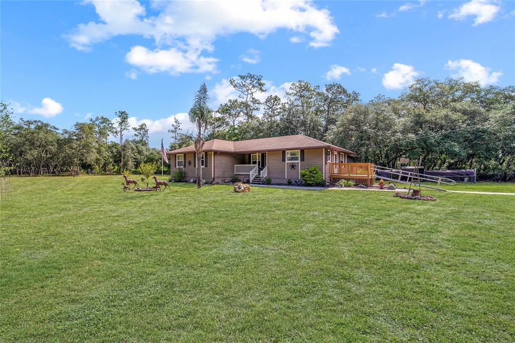 15755 Southwest 90th Avenue Dunnellon, FL 34432 - Photo 45 of 55 a view of a house with a big yard