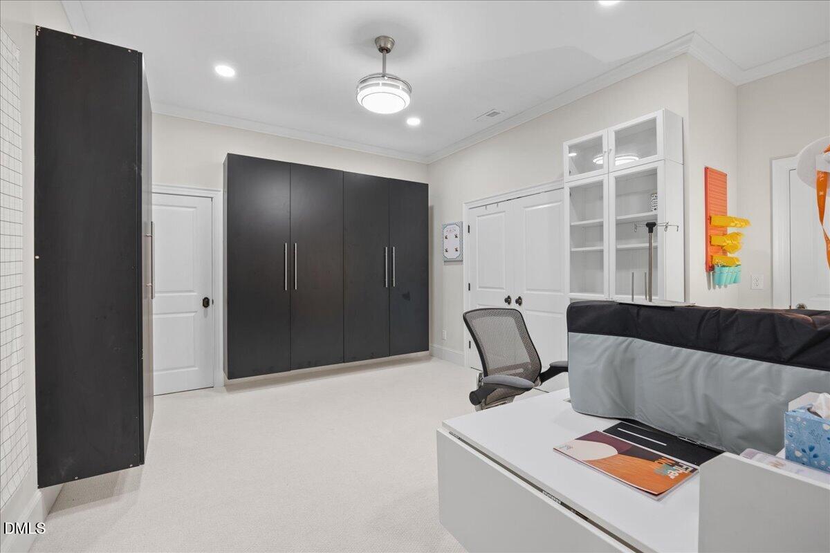 1504 Consett Court Raleigh, NC 27613 - Photo 60 of 81 Lower level flex room with built in storage