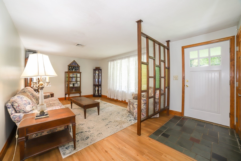 40 Old Stage Road Chelmsford, MA 01824 - Photo 11 of 34 a living room with furniture and a window