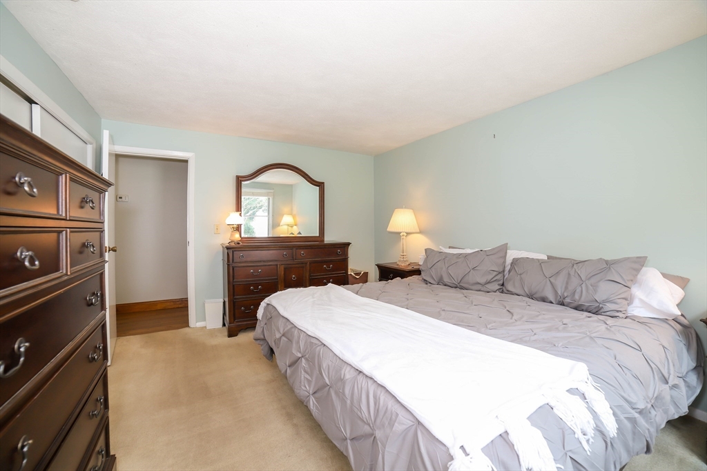 40 Old Stage Road Chelmsford, MA 01824 - Photo 16 of 34 a bedroom with a bed and a dresser