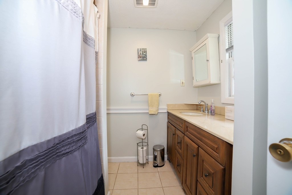40 Old Stage Road Chelmsford, MA 01824 - Photo 22 of 34 a utility room with a sink a washer and dryer