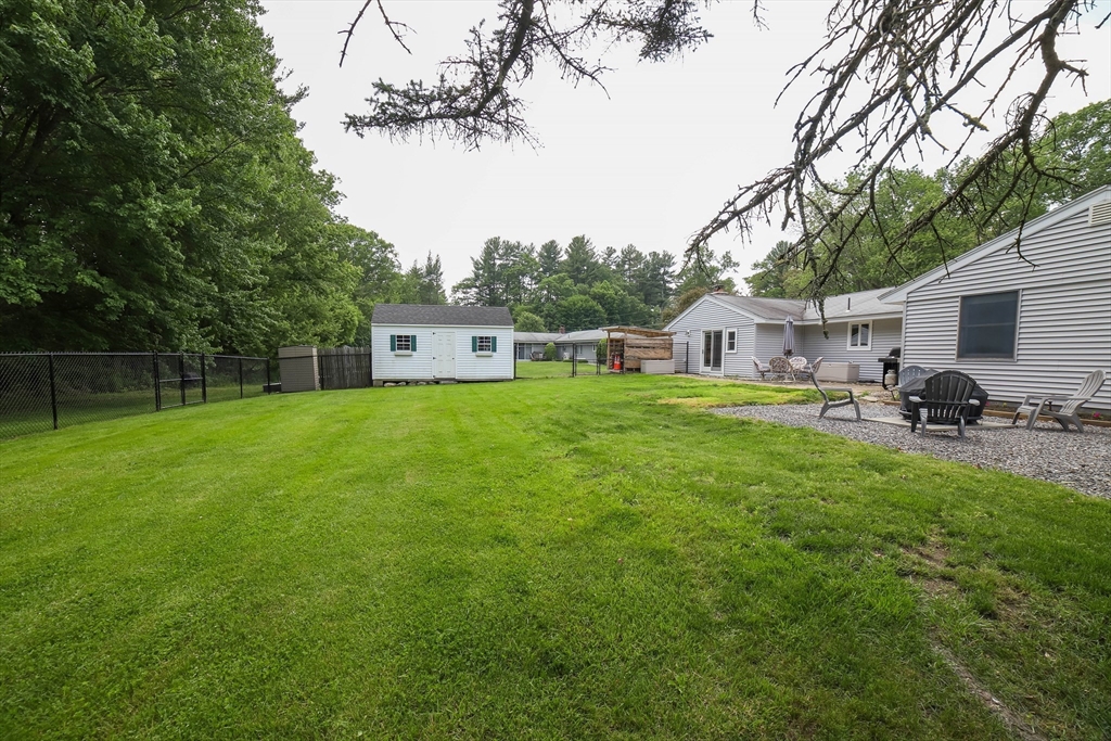 40 Old Stage Road Chelmsford, MA 01824 - Photo 28 of 34 a view of a house with backyard and sitting area