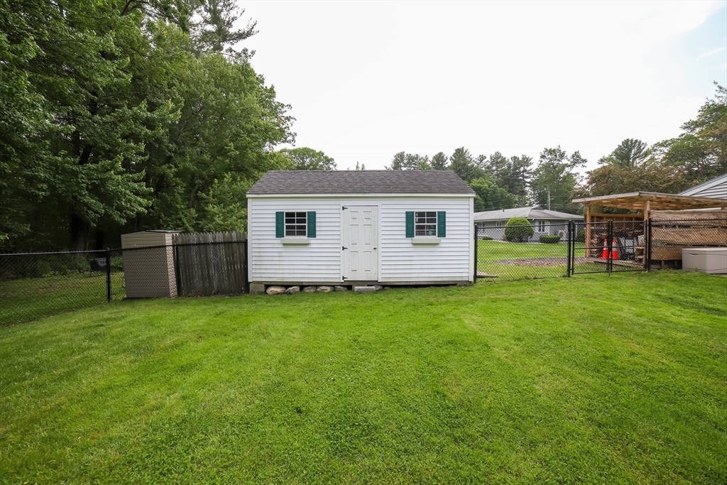 40 Old Stage Road Chelmsford, MA 01824 - Photo 32 of 34 a view of a backyard with a garden and plants