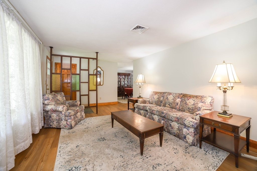 40 Old Stage Road Chelmsford, MA 01824 - Photo 10 of 34 a living room with furniture and a window
