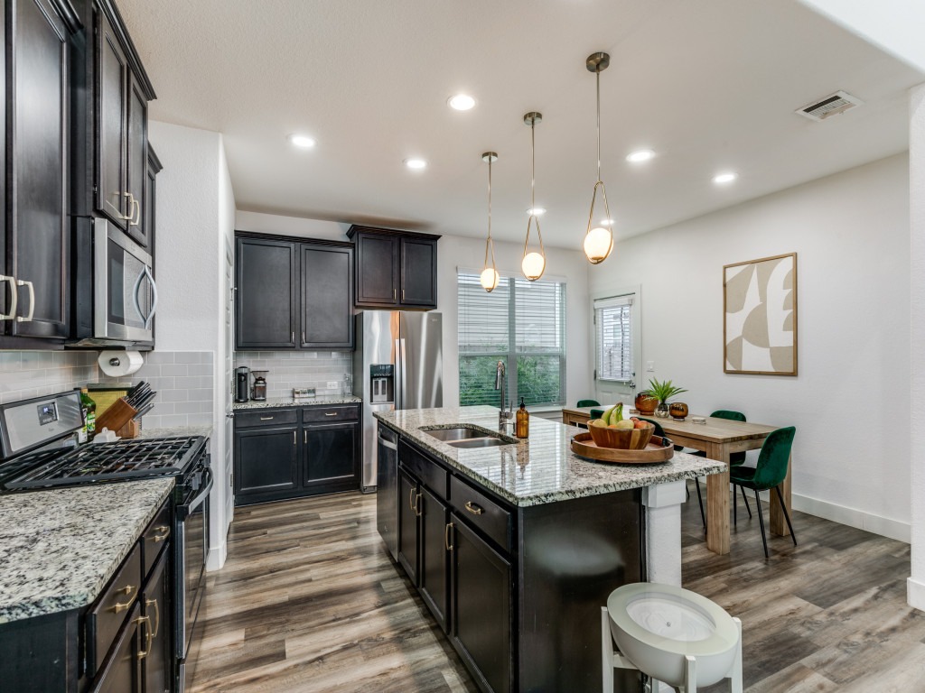 2204 Montague Street Austin, TX 78741 - Photo 13 of 25 a kitchen with a stove a refrigerator and a stove