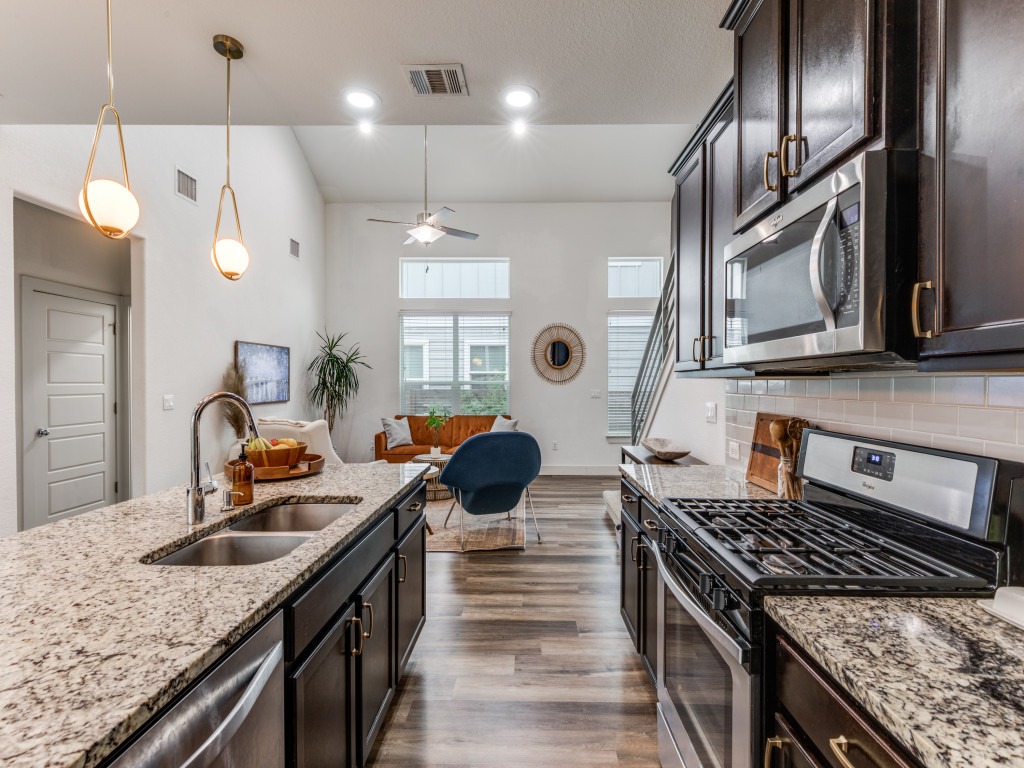 2204 Montague Street Austin, TX 78741 - Photo 15 of 25 a kitchen with stove a sink and refrigerator