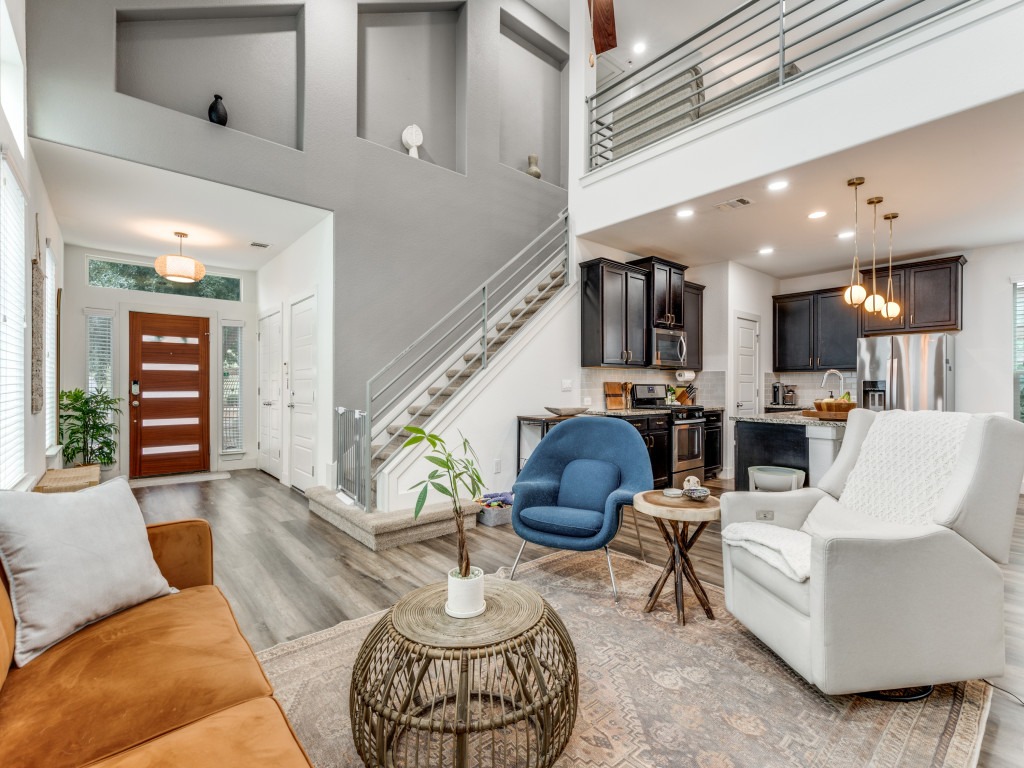 2204 Montague Street Austin, TX 78741 - Photo 2 of 25 a living room with furniture or kitchen view and a chandelier