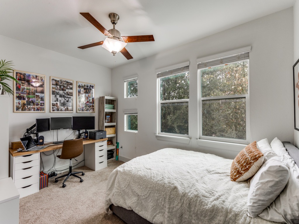 2204 Montague Street Austin, TX 78741 - Photo 20 of 25 a bedroom that has a bed and a desk in it