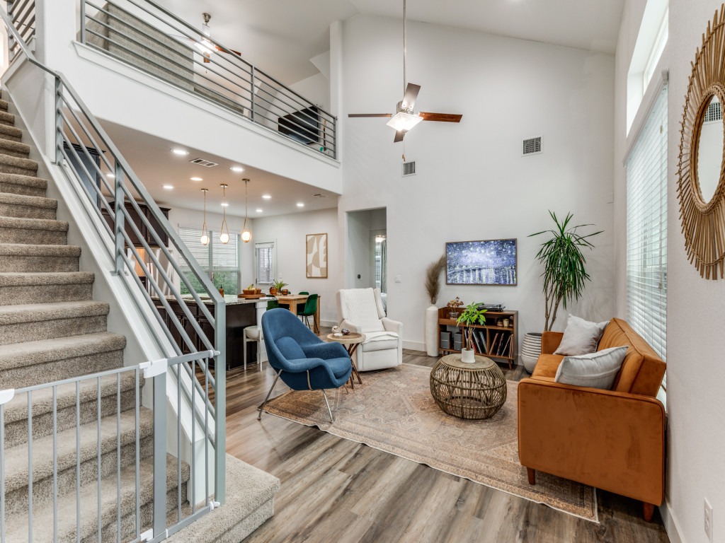 2204 Montague Street Austin, TX 78741 - Photo 3 of 25 a living room with furniture and a chandelier