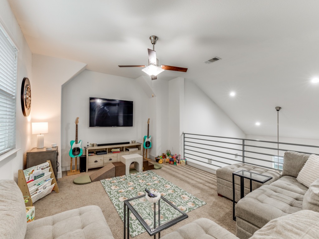 2204 Montague Street Austin, TX 78741 - Photo 5 of 25 a living room with furniture and a flat screen tv