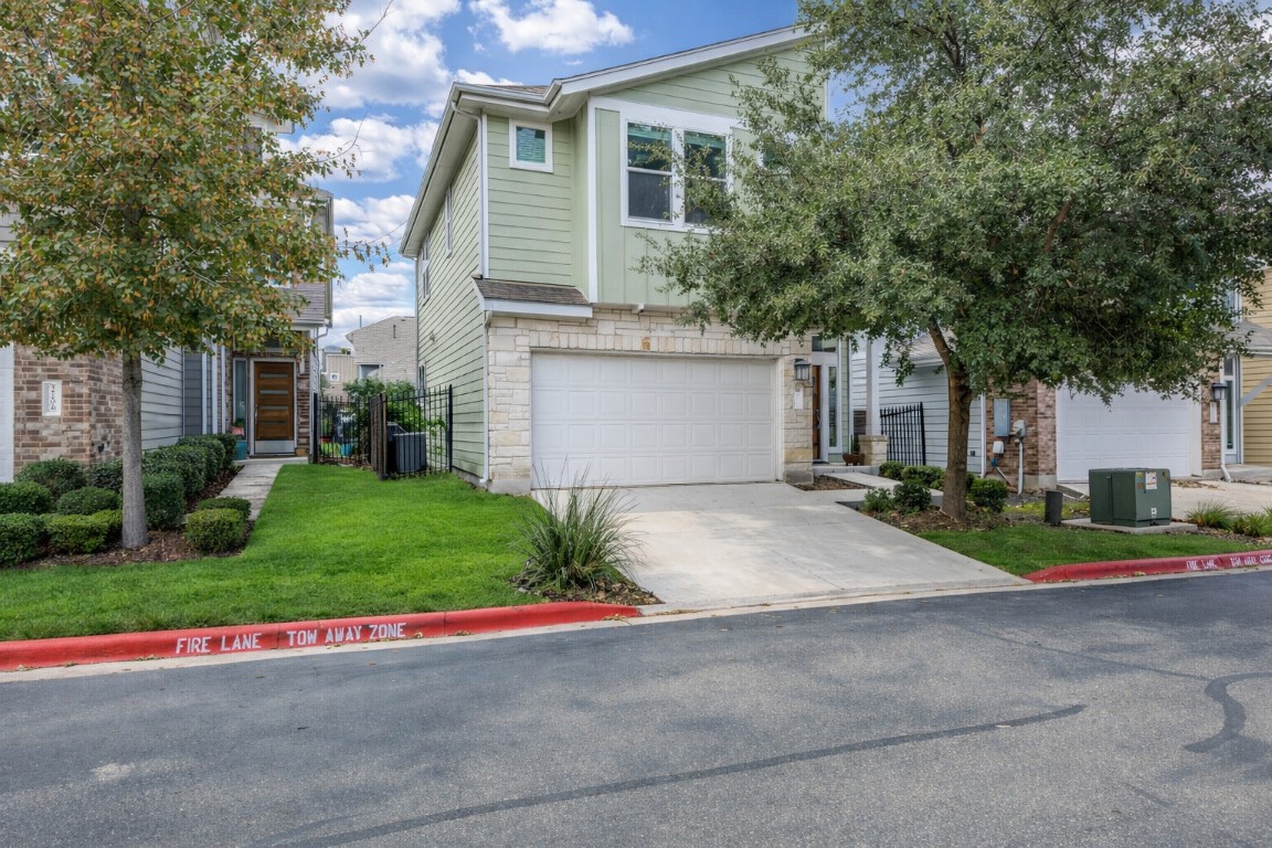 2204 Montague Street Austin, TX 78741 - Photo 6 of 25 a front view of house with yard and green space