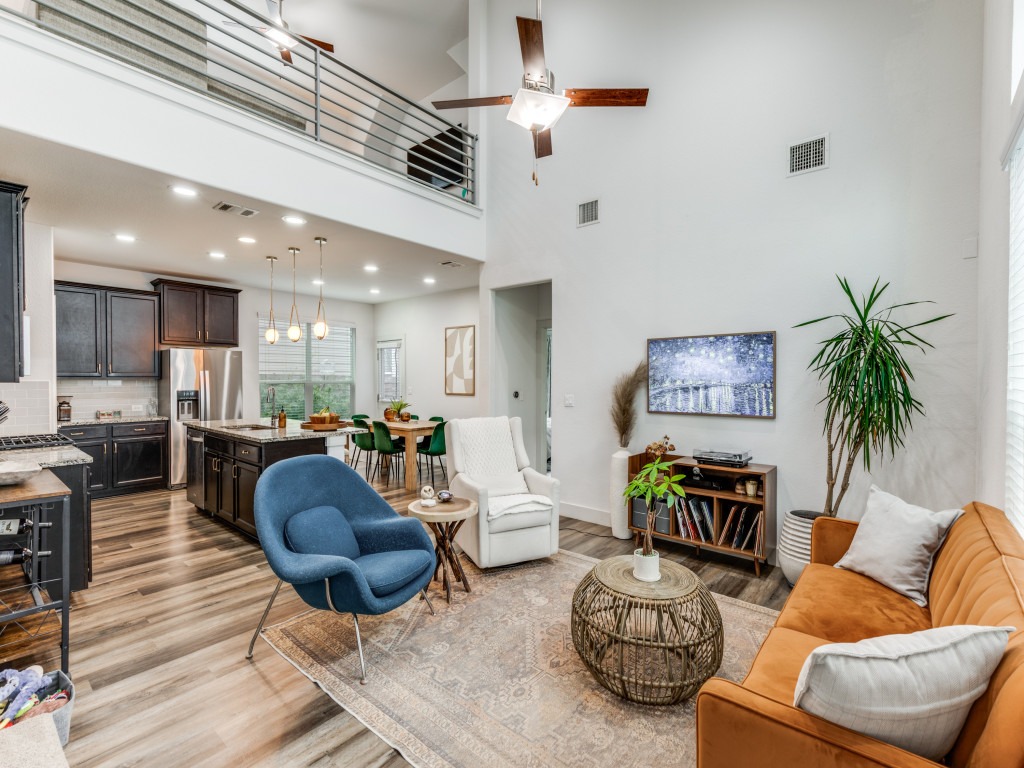 2204 Montague Street Austin, TX 78741 - Photo 8 of 25 a living room with furniture kitchen view and a potted plant