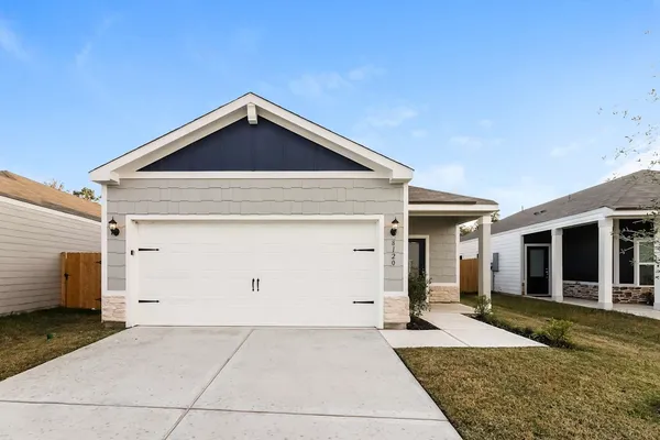a front view of a house with garage