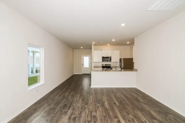 a view of kitchen with wooden floor