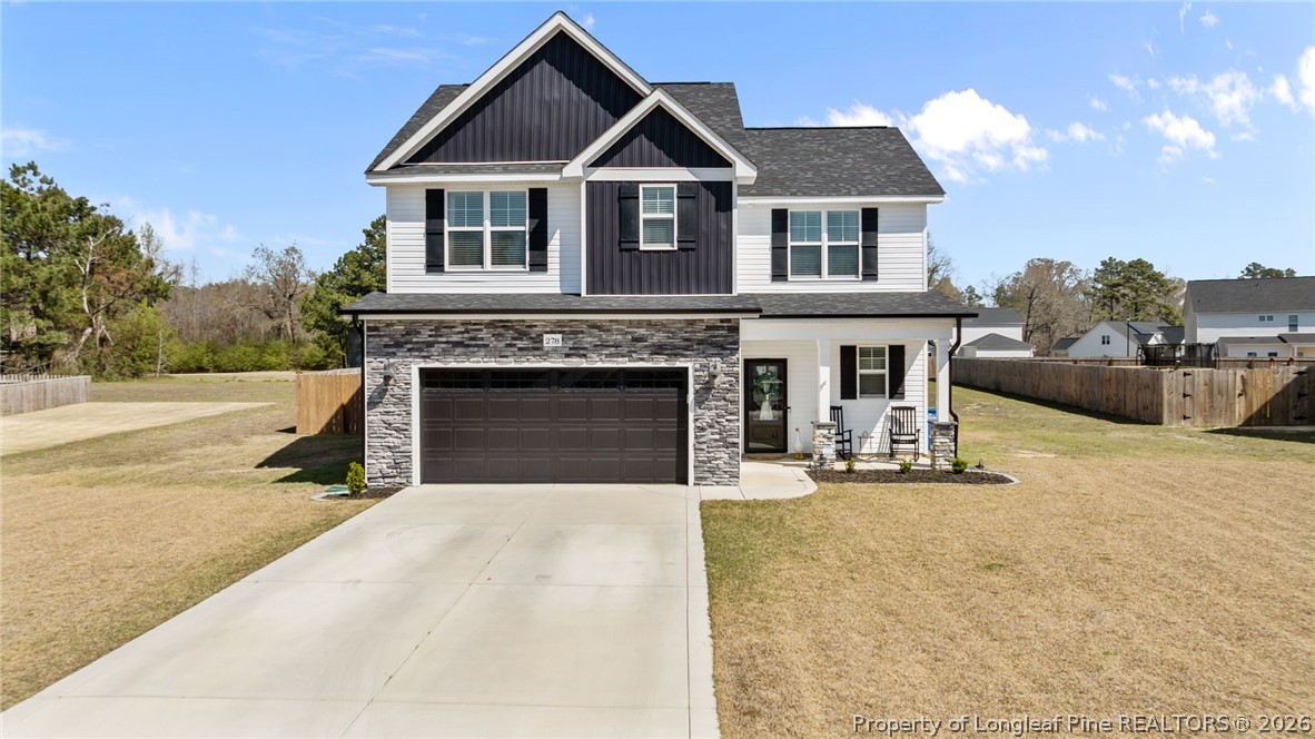 278 Slade Corner Road Raeford, NC 28376 - Photo 1 of 39 a front view of a house with yard and parking