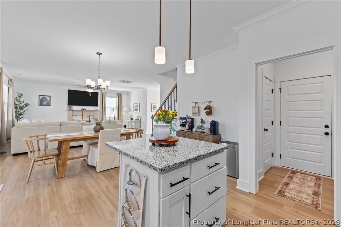 278 Slade Corner Road Raeford, NC 28376 - Photo 14 of 39 a view of kitchen island with granite countertop living room