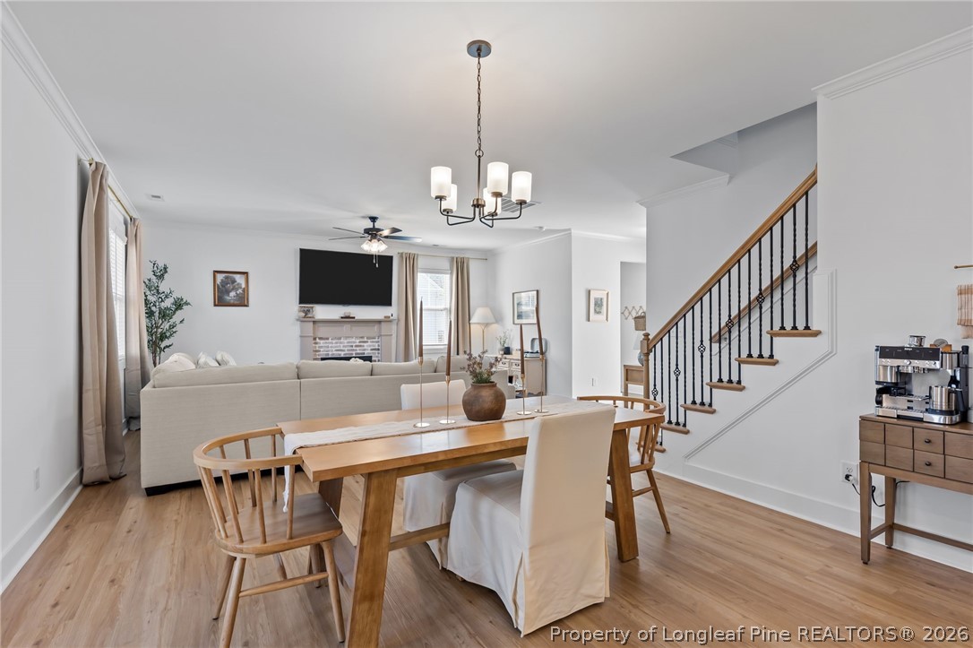 278 Slade Corner Road Raeford, NC 28376 - Photo 17 of 39 a view of a dining room with furniture window and wooden floor
