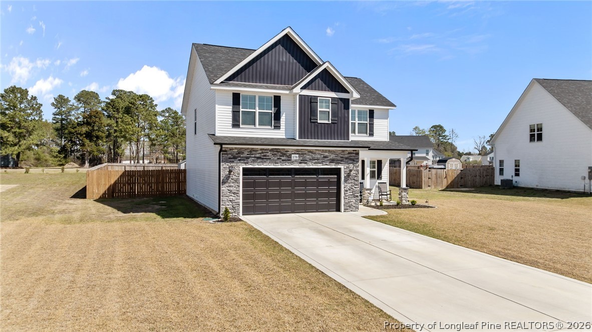 278 Slade Corner Road Raeford, NC 28376 - Photo 2 of 39 a front view of a house with a yard