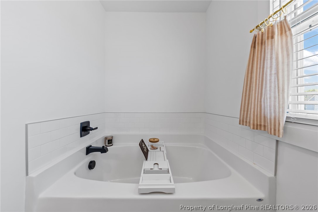 278 Slade Corner Road Raeford, NC 28376 - Photo 22 of 39 a bathroom with a bathtub