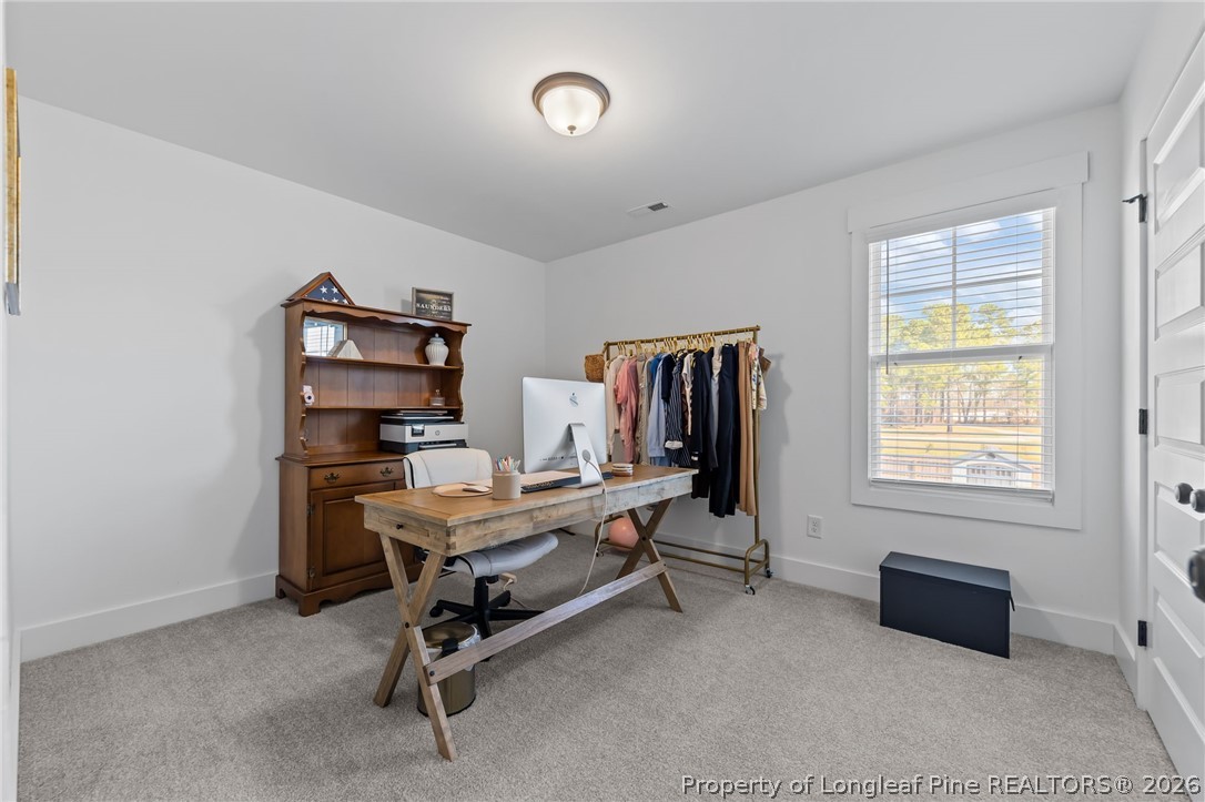 278 Slade Corner Road Raeford, NC 28376 - Photo 25 of 39 a view of a workspace with furniture and a window
