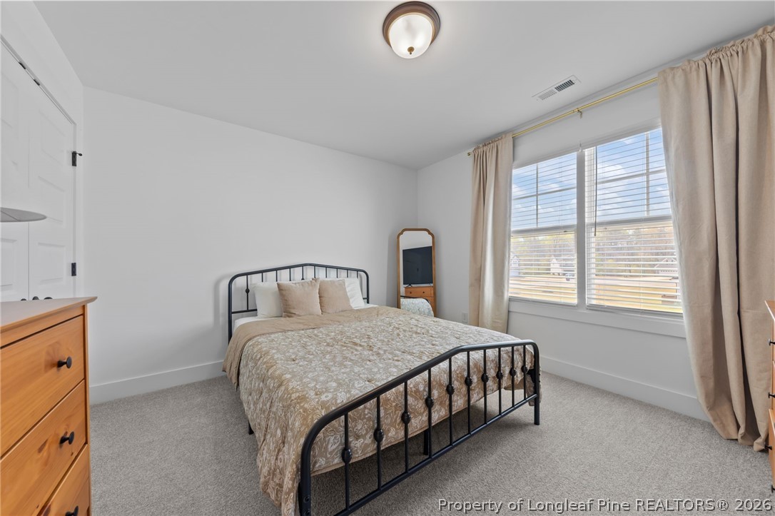 278 Slade Corner Road Raeford, NC 28376 - Photo 30 of 39 a bedroom with a bed and a window