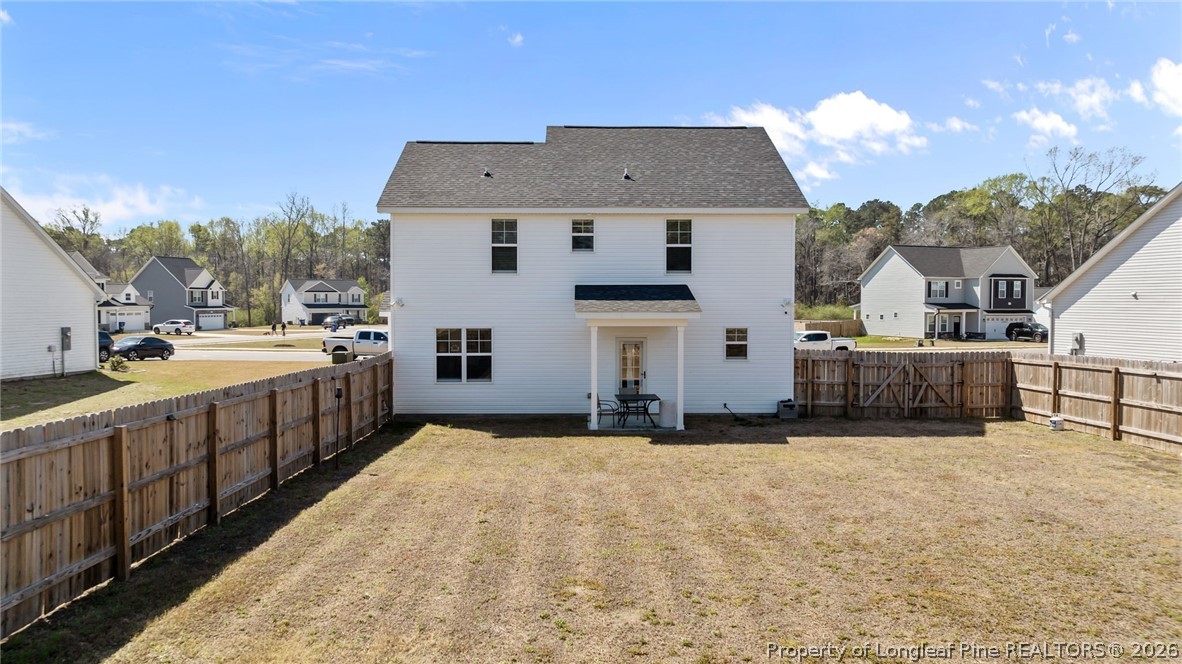 278 Slade Corner Road Raeford, NC 28376 - Photo 35 of 39 a view of a house with a backyard