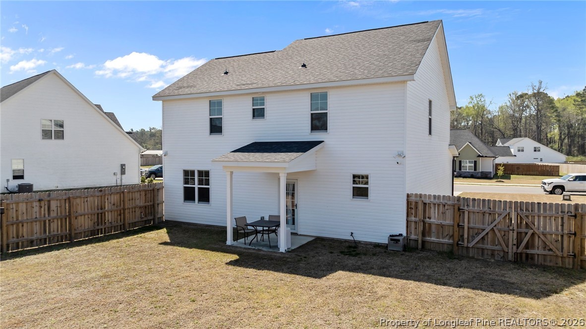 278 Slade Corner Road Raeford, NC 28376 - Photo 36 of 39 a view of a house with a yard