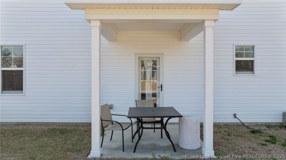 278 Slade Corner Road Raeford, NC 28376 - Photo 38 of 39 a view of a door and chair in back of the house