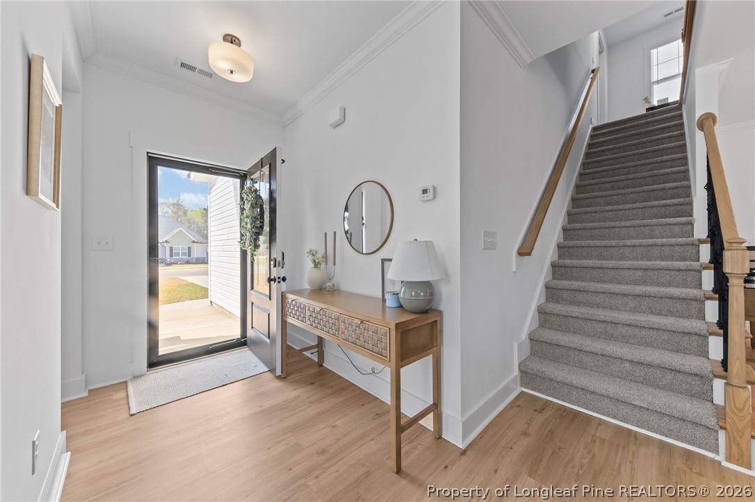 278 Slade Corner Road Raeford, NC 28376 - Photo 5 of 39 a view of entryway and hall with wooden floor