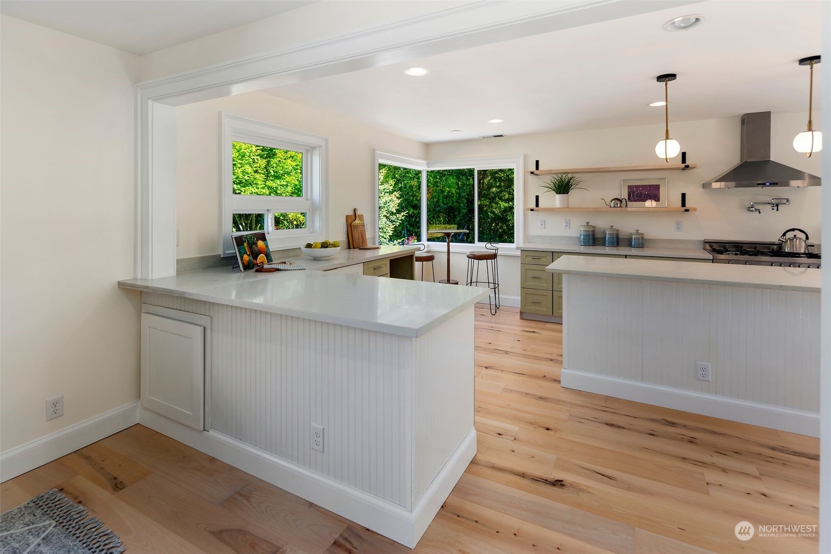 24124 7th Avenue Southeast Bothell, WA 98021 - Photo 14 of 40 a kitchen with stainless steel appliances granite countertop a sink a stove and wooden floor