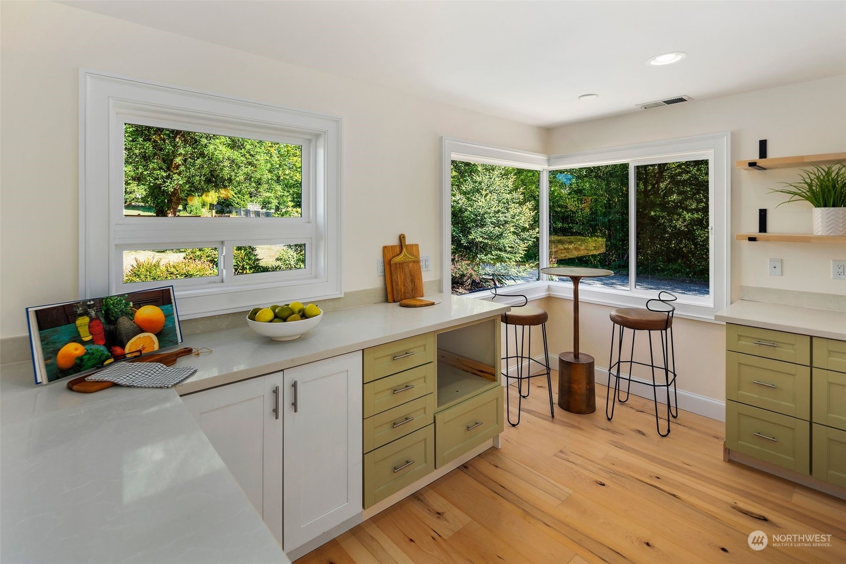 24124 7th Avenue Southeast Bothell, WA 98021 - Photo 15 of 40 a kitchen with wooden cabinets and dining table