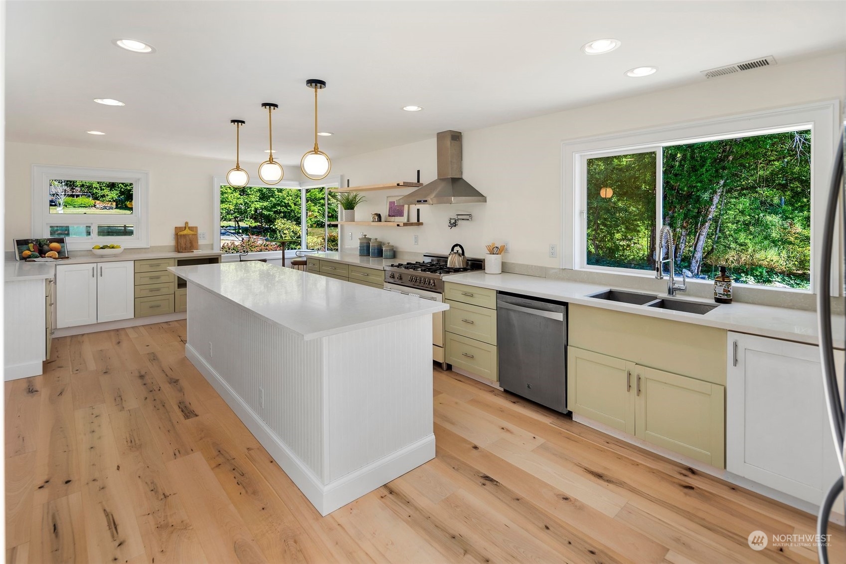 24124 7th Avenue Southeast Bothell, WA 98021 - Photo 20 of 40 a kitchen with a sink stove cabinets and wooden floor
