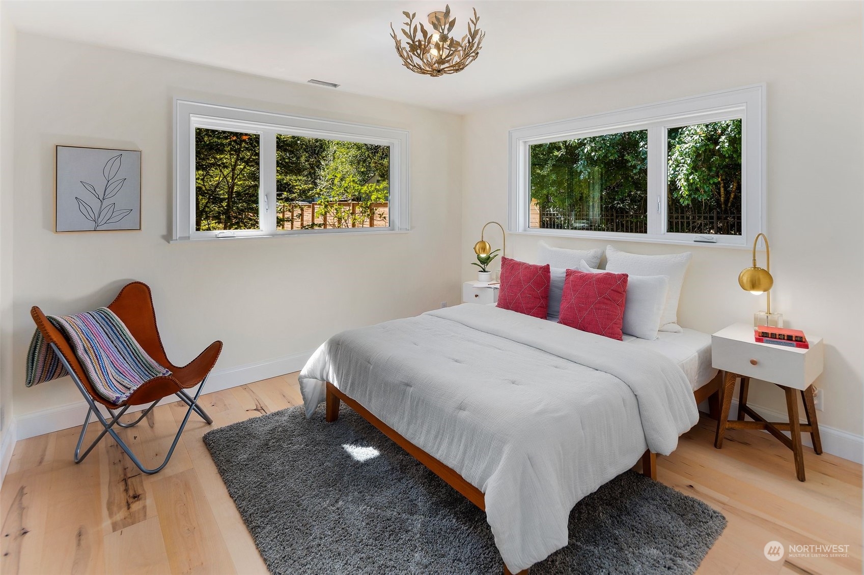 24124 7th Avenue Southeast Bothell, WA 98021 - Photo 22 of 40 a bedroom with a bed a dresser and a large window
