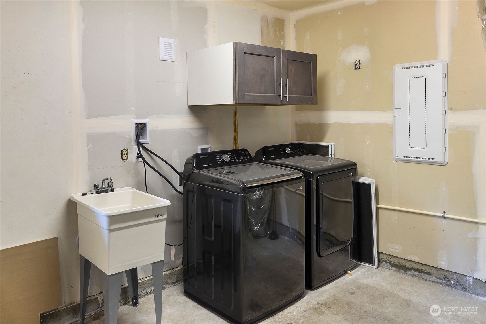 24124 7th Avenue Southeast Bothell, WA 98021 - Photo 29 of 40 a utility room with stainless steel appliances granite countertop a sink stove and refrigerator
