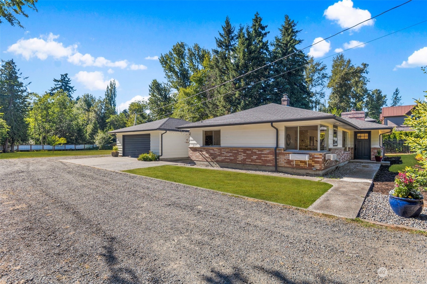 24124 7th Avenue Southeast Bothell, WA 98021 - Photo 32 of 40 a front view of a house with swimming pool having outdoor seating