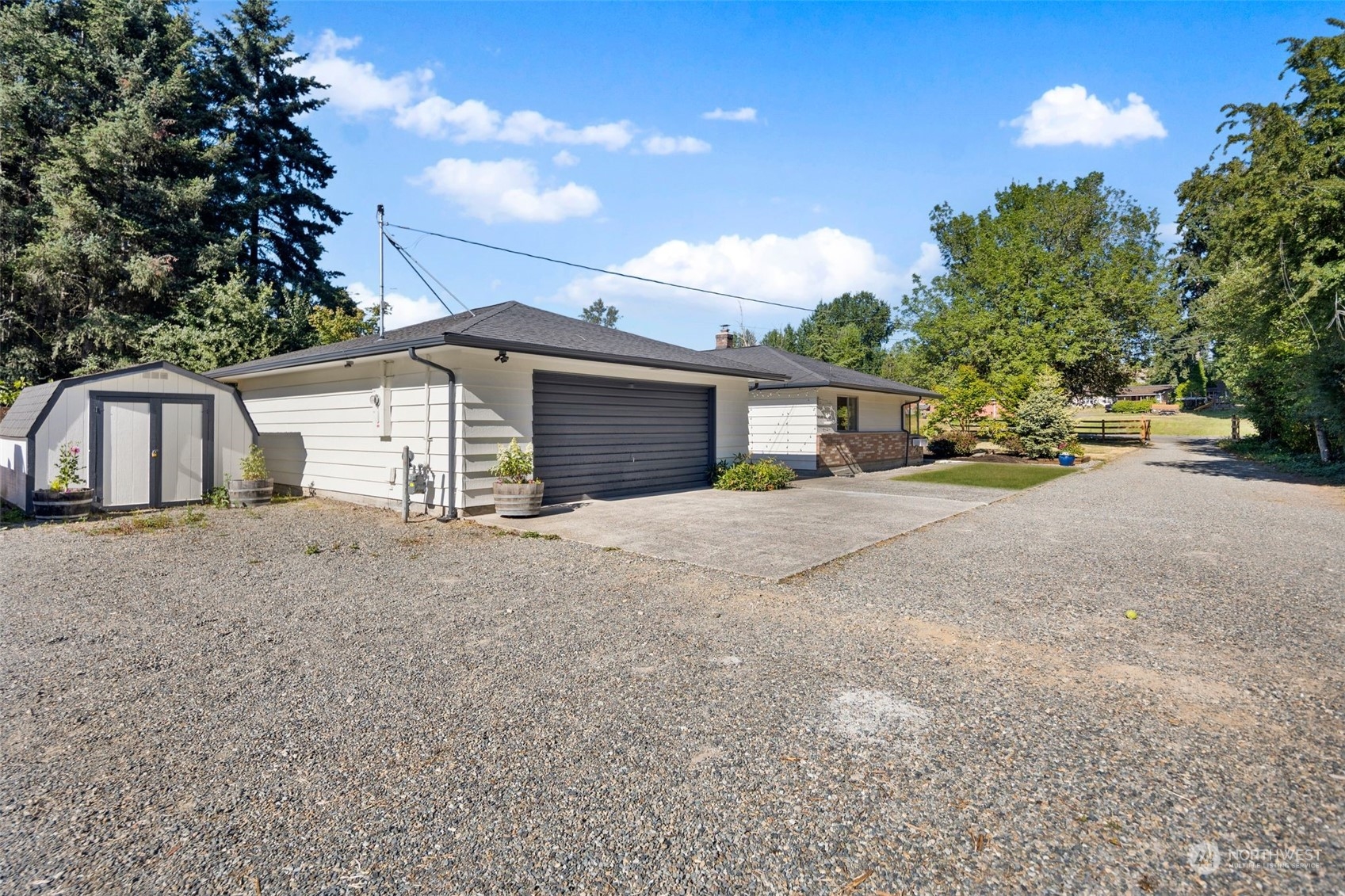 24124 7th Avenue Southeast Bothell, WA 98021 - Photo 33 of 40 a front view of a house with a yard and garage