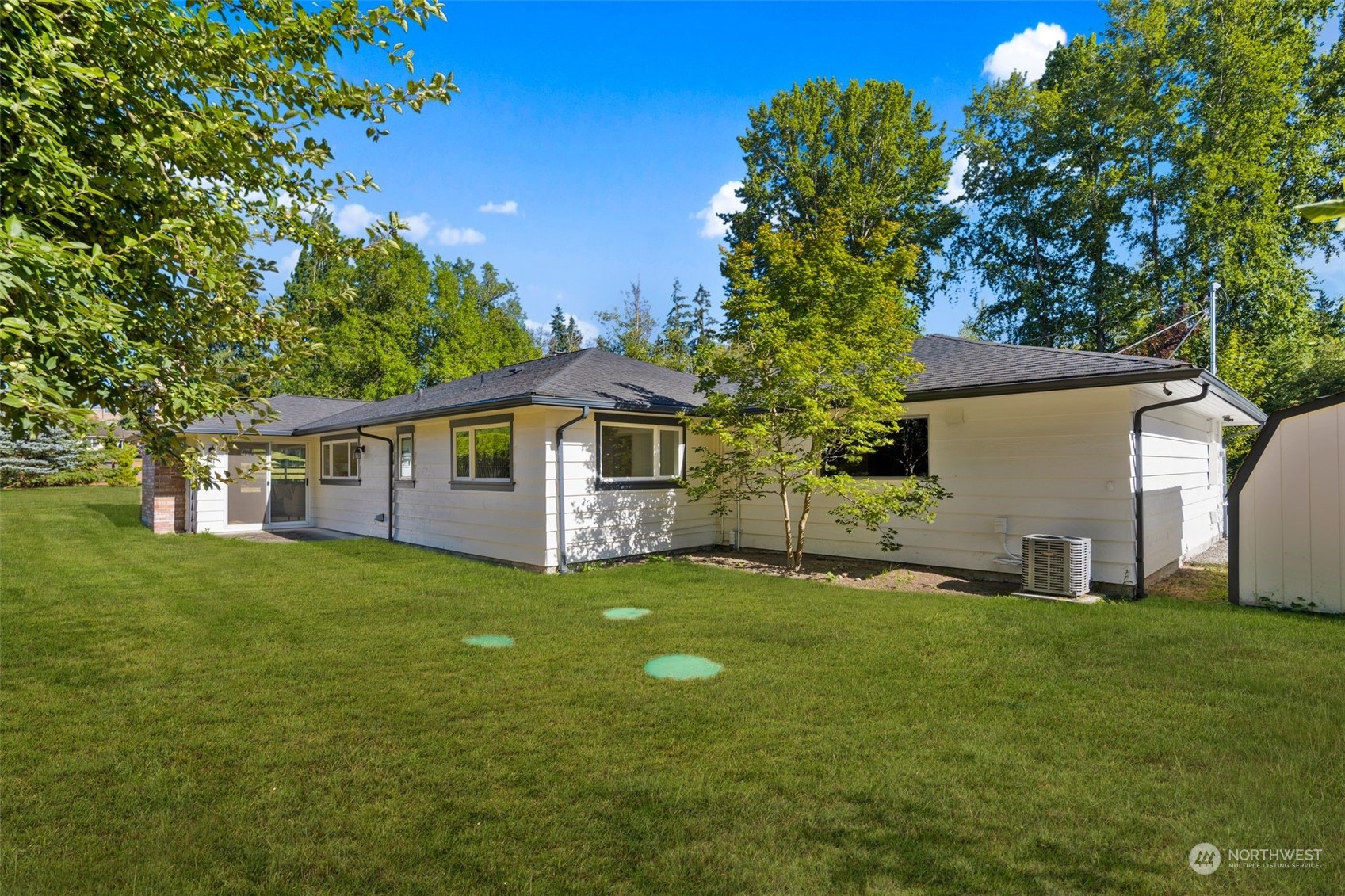 24124 7th Avenue Southeast Bothell, WA 98021 - Photo 34 of 40 a yellow house in middle of the green field