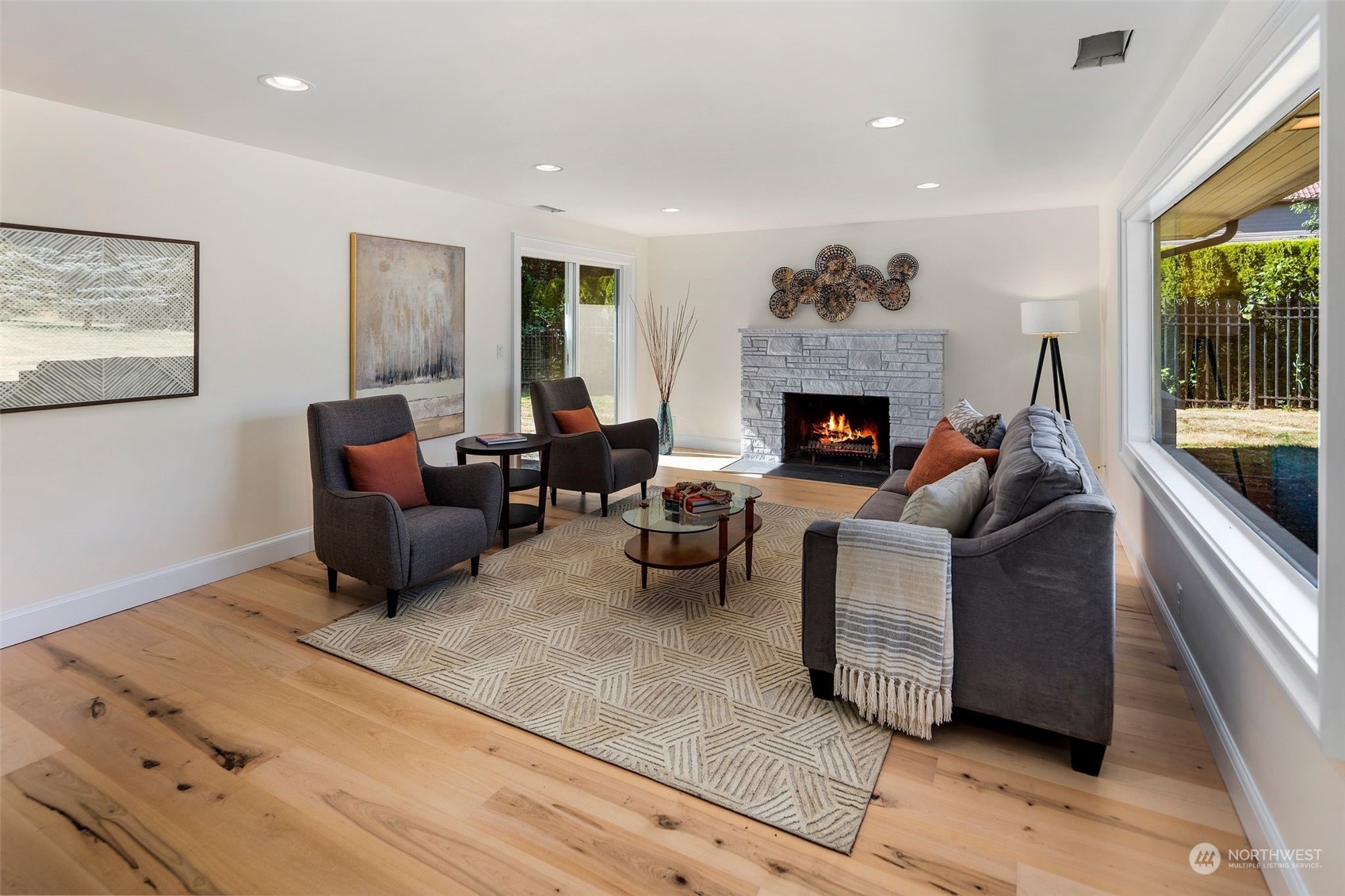 24124 7th Avenue Southeast Bothell, WA 98021 - Photo 10 of 40 a living room with furniture and a fireplace