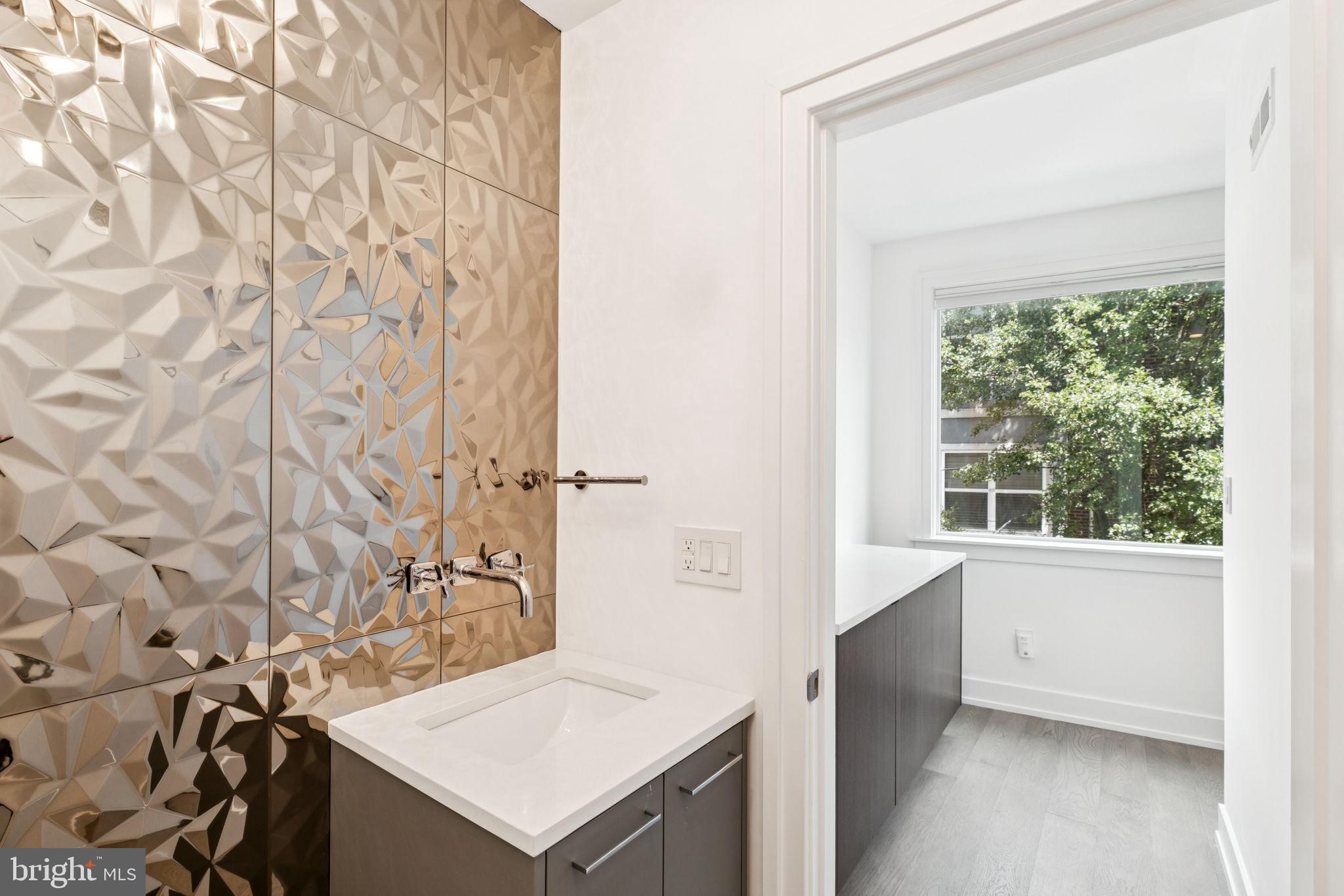 618 South Clarion Street Philadelphia, PA 19147 - Photo 11 of 65 a bathroom with a sink toilet and shower