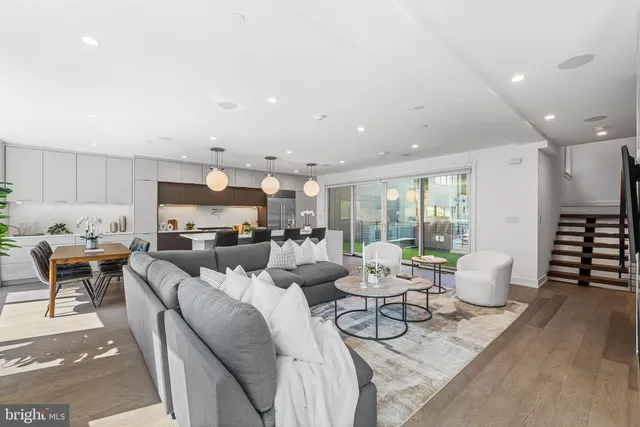 a large kitchen with kitchen island a large island in it