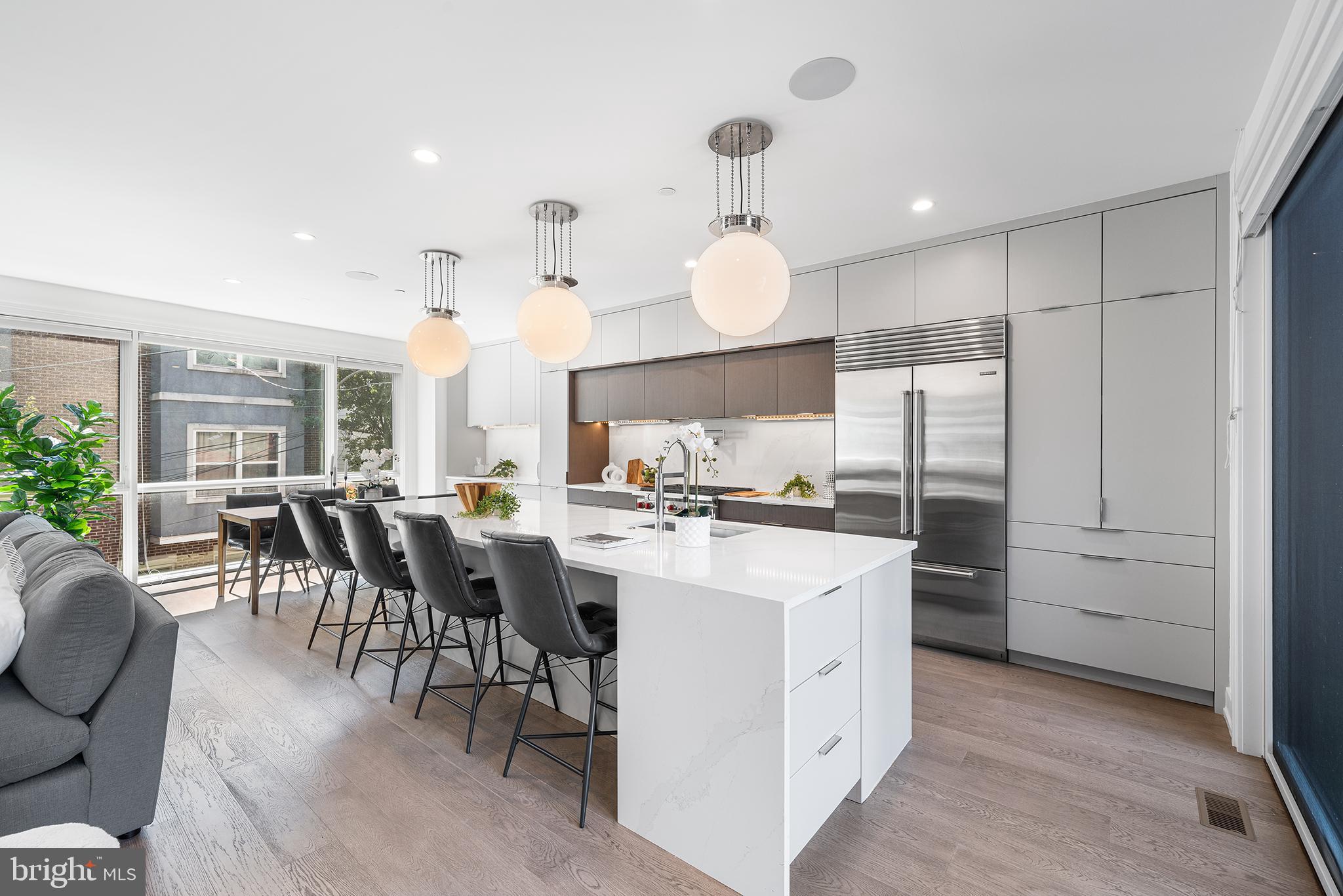 618 South Clarion Street Philadelphia, PA 19147 - Photo 15 of 65 a kitchen with cabinets and chairs