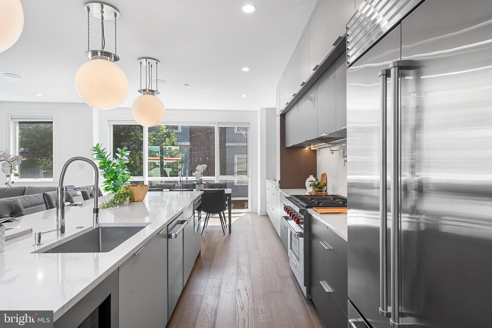 618 South Clarion Street Philadelphia, PA 19147 - Photo 16 of 65 a kitchen with stainless steel appliances a sink a counter top space a large window and stainless steel appliances