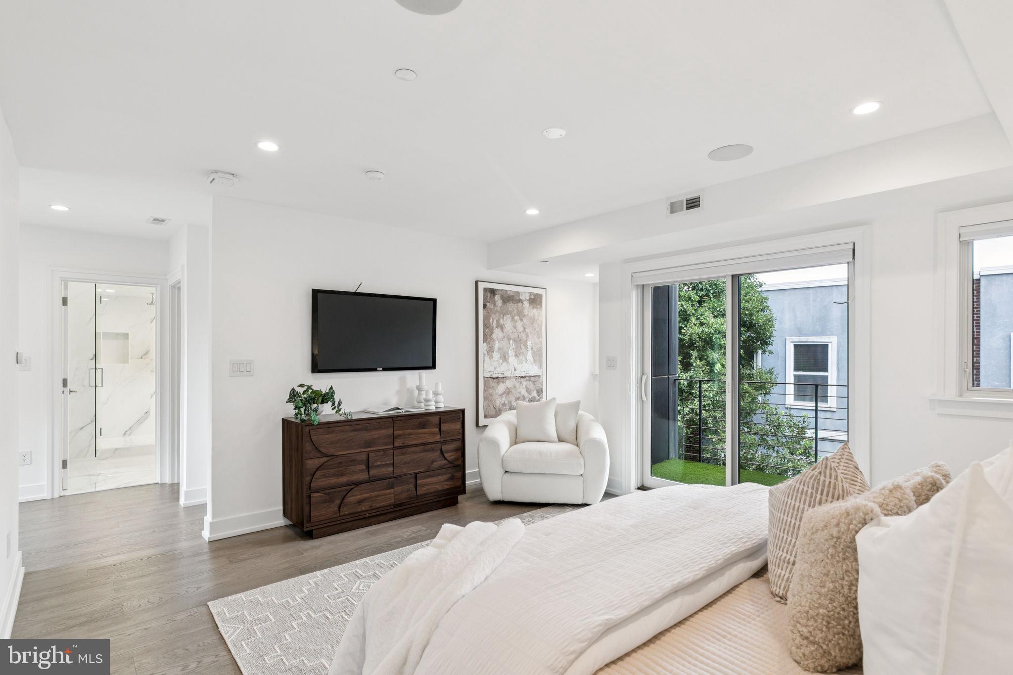 618 South Clarion Street Philadelphia, PA 19147 - Photo 25 of 65 a bedroom with a bed and a television