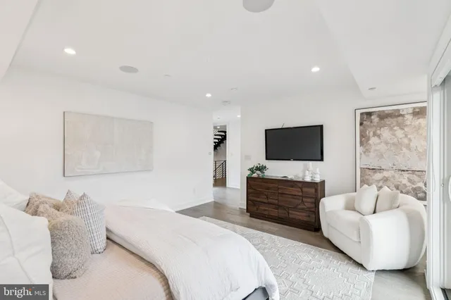 a bathroom with a shower a mirror and a sink